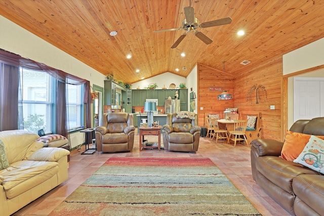 living room featuring high vaulted ceiling, wooden walls, ceiling fan, light tile patterned flooring, and wood ceiling