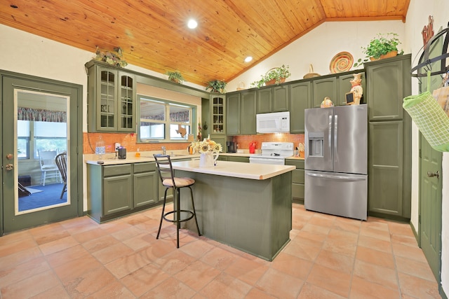 kitchen featuring a center island, wooden ceiling, white appliances, and green cabinetry