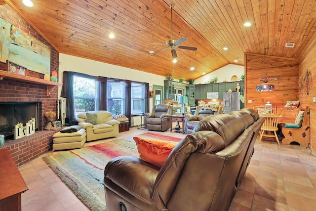 tiled living room featuring ceiling fan, wooden ceiling, a brick fireplace, high vaulted ceiling, and wood walls