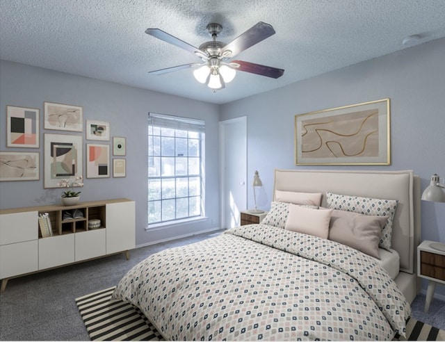 bedroom featuring carpet flooring, ceiling fan, and a textured ceiling