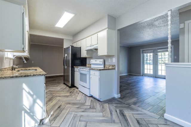 kitchen with french doors, white cabinets, sink, dark stone countertops, and white range with electric stovetop