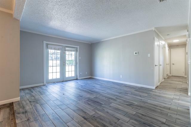 unfurnished room with french doors, light hardwood / wood-style floors, and a textured ceiling