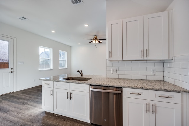 kitchen with sink, stainless steel dishwasher, tasteful backsplash, dark hardwood / wood-style flooring, and white cabinetry