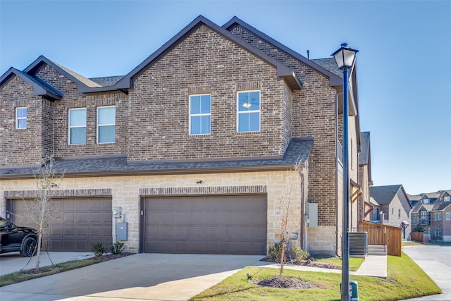 view of front of property featuring a garage and a front yard