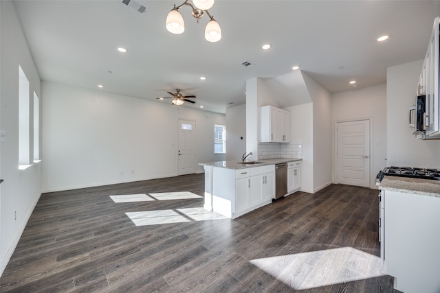 kitchen with white cabinets, dark wood-type flooring, and stainless steel appliances