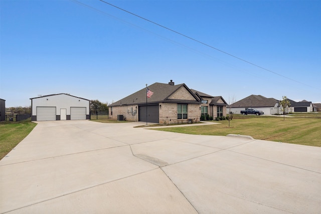 view of front of house with a garage and a front lawn