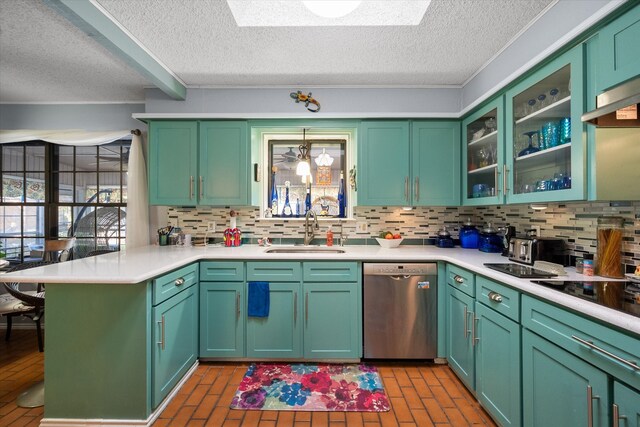 kitchen featuring stainless steel dishwasher, green cabinetry, and sink