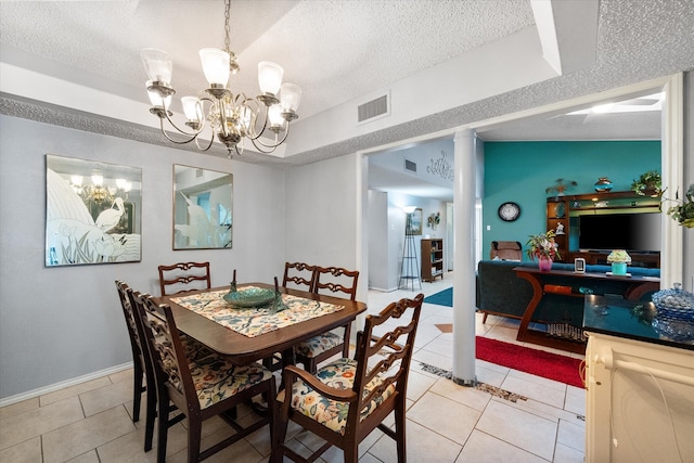 tiled dining space featuring a textured ceiling, an inviting chandelier, and lofted ceiling