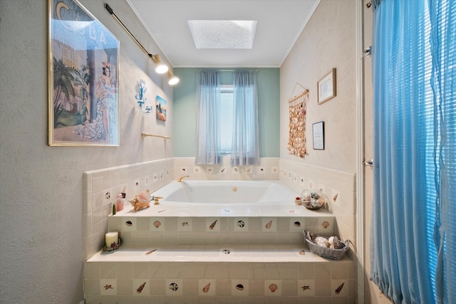 bathroom with tiled tub and a skylight