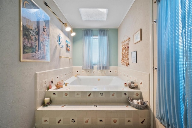 bathroom with a relaxing tiled tub and a skylight