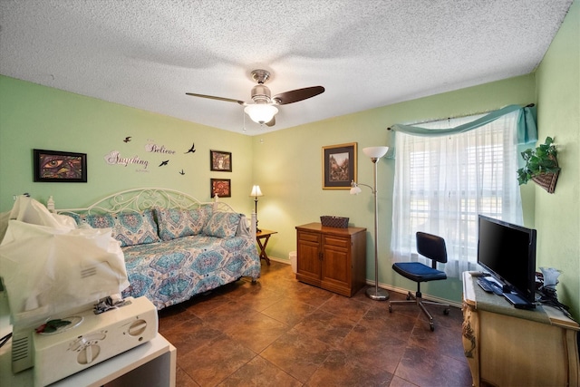 1208 Lexington Sq, Corsicana, TX 75110 - bedroom with ceiling fan, a textured ceiling, and baseboards