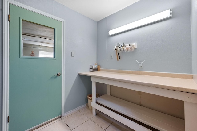 bathroom with tile patterned floors