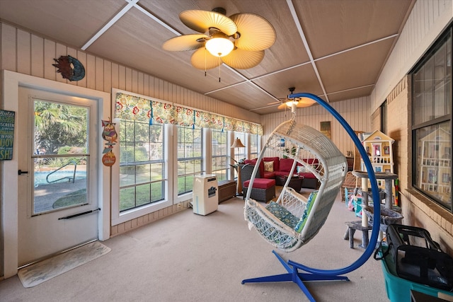 sunroom / solarium with ceiling fan