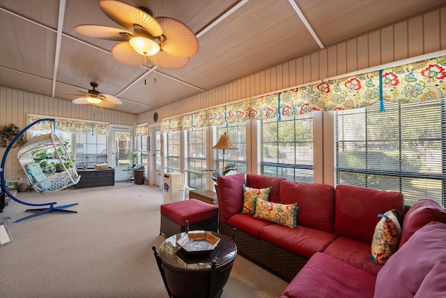 sunroom featuring ceiling fan