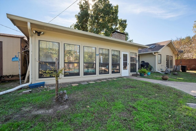 1208 Lexington Sq, Corsicana, TX 75110 - rear view of house featuring a chimney