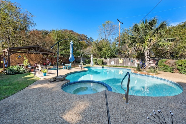 view of pool with a gazebo, a patio area, and an in ground hot tub