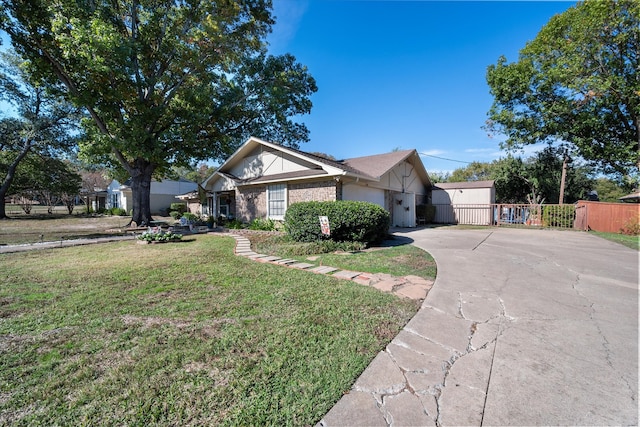 ranch-style house with a front lawn