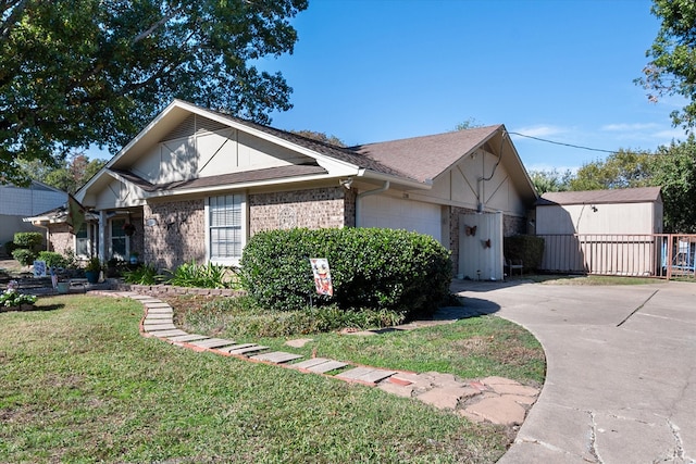 view of front of property with a garage and a front yard