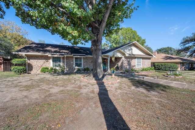 ranch-style home featuring a front yard