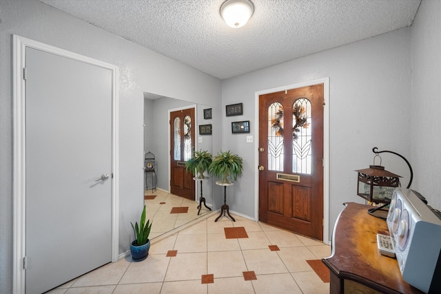 tiled entrance foyer with a wealth of natural light and a textured ceiling