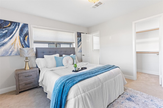 bedroom with light colored carpet