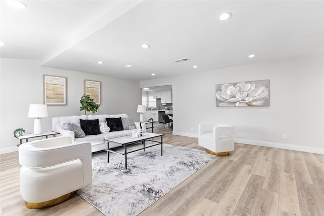 living room with light hardwood / wood-style flooring