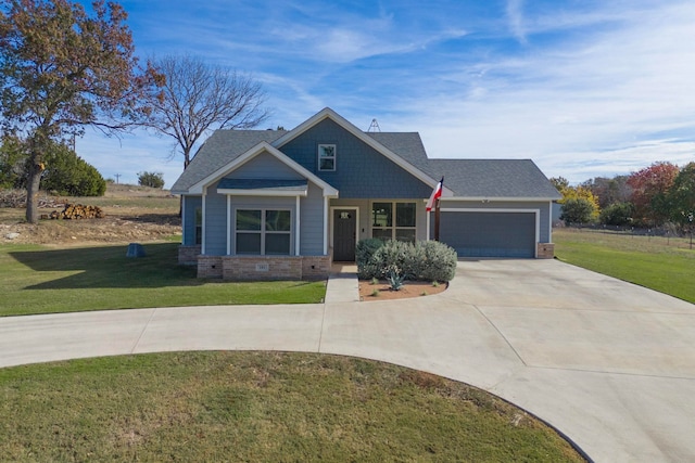 craftsman-style house featuring a front yard and a garage