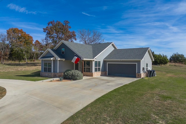 view of front of property with a garage and a front lawn