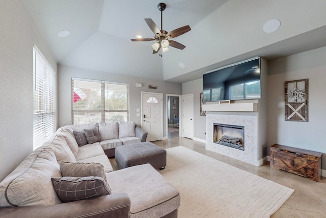 living room featuring high vaulted ceiling, ceiling fan, and light tile patterned flooring