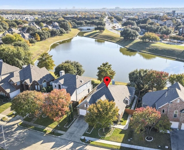 birds eye view of property featuring a water view