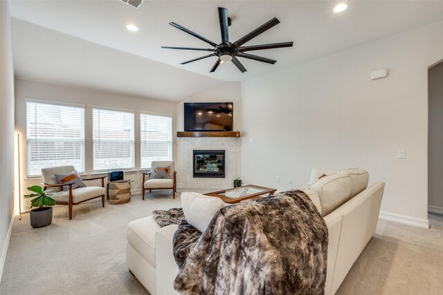 living room featuring light carpet, vaulted ceiling, and ceiling fan