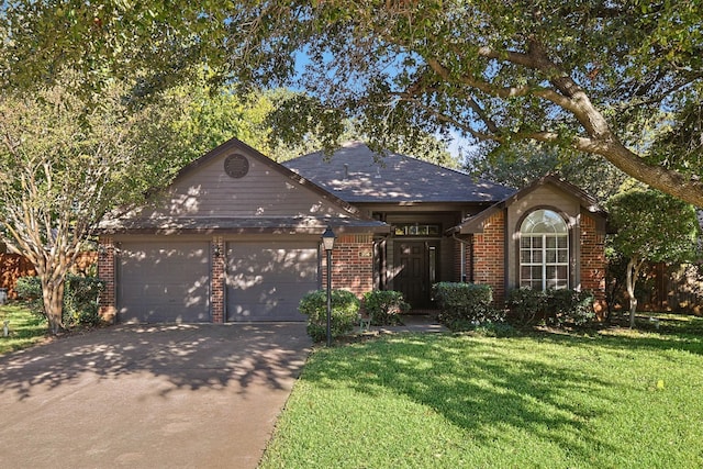 single story home featuring a front yard and a garage