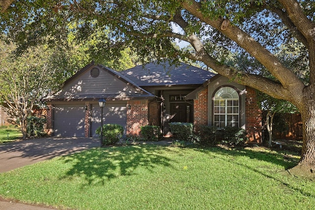 ranch-style home with a garage and a front lawn