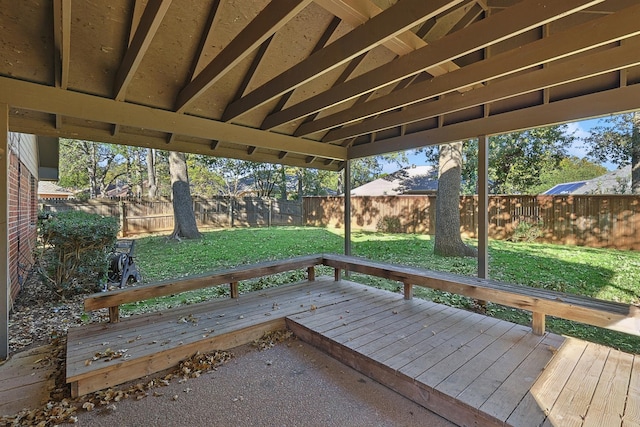 wooden terrace with a yard