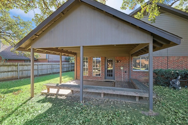 back of house featuring a yard