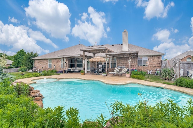 view of swimming pool with a jacuzzi, a pergola, and a patio