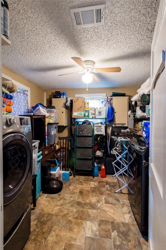 washroom with washer / clothes dryer, ceiling fan, and a textured ceiling