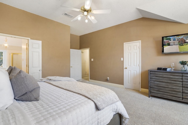 bedroom with light colored carpet, vaulted ceiling, and ceiling fan