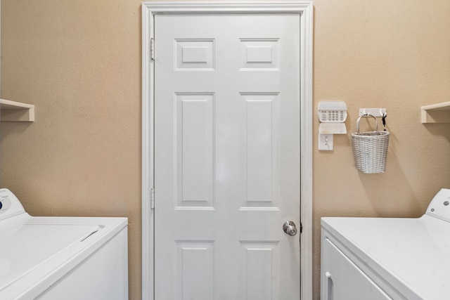 clothes washing area featuring washing machine and dryer