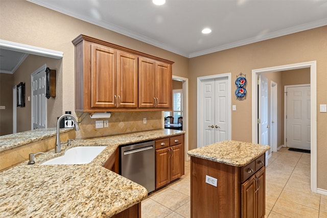 kitchen featuring sink, crown molding, stainless steel dishwasher, decorative backsplash, and light stone counters