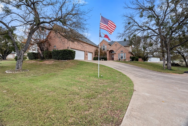 view of front facade featuring a front lawn and a garage