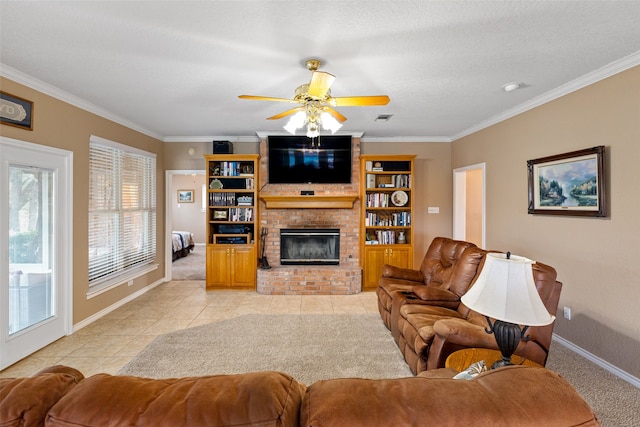 living room with ceiling fan, ornamental molding, a textured ceiling, and a brick fireplace