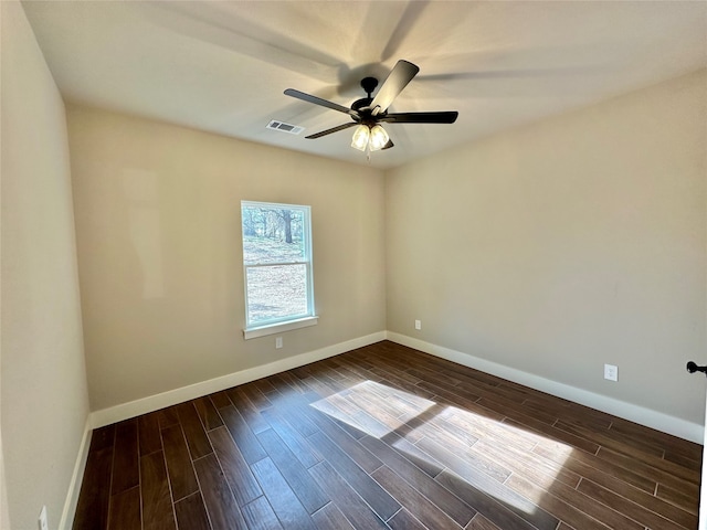 unfurnished room with dark hardwood / wood-style floors and ceiling fan