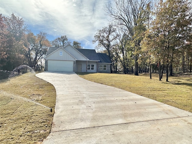 view of front of house with a front lawn and a garage