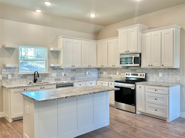 kitchen featuring white cabinets, sink, and appliances with stainless steel finishes