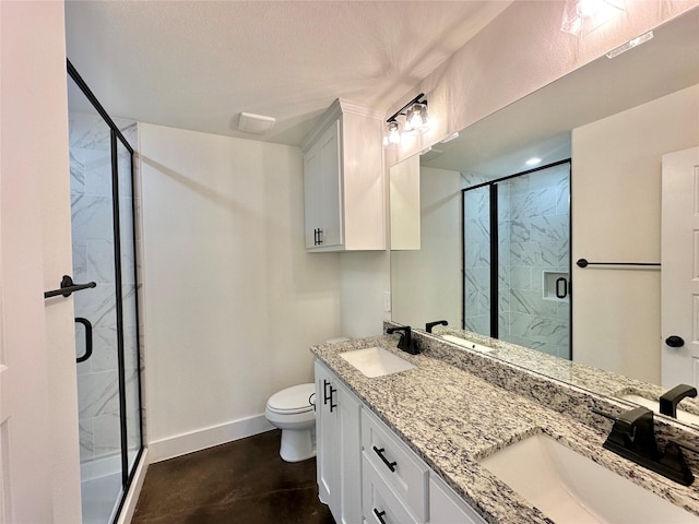 bathroom featuring vanity, toilet, concrete flooring, and walk in shower