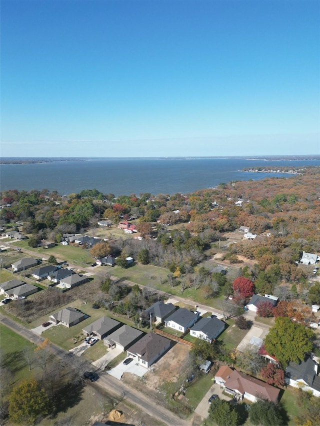 birds eye view of property with a residential view and a water view