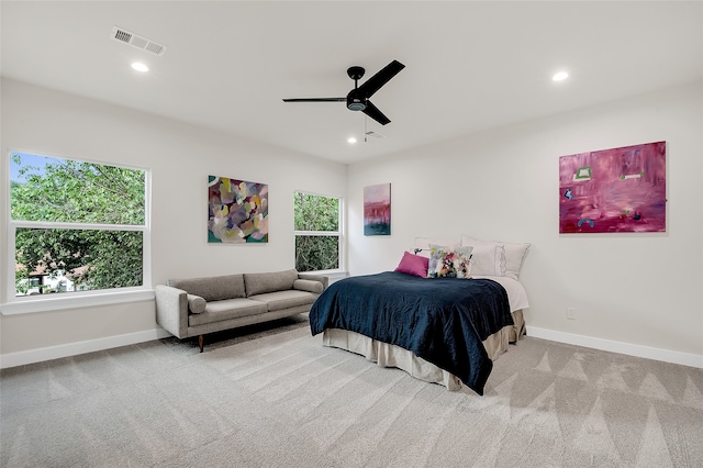 bedroom featuring ceiling fan and light colored carpet