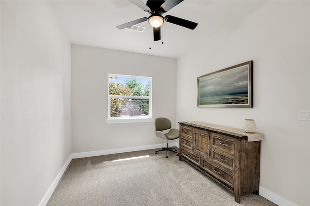 interior space featuring light carpet and ceiling fan