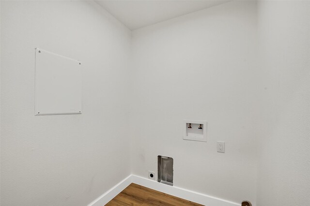 laundry area with hardwood / wood-style flooring and washer hookup